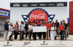Walmart and Coca-Cola Consolidated presented a $100,000 check to Speedway Children’s Charities' Charlotte chapter on Friday.